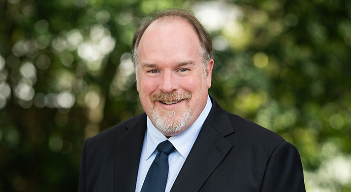 Dr Bret McVinish smiling outdoor portrait